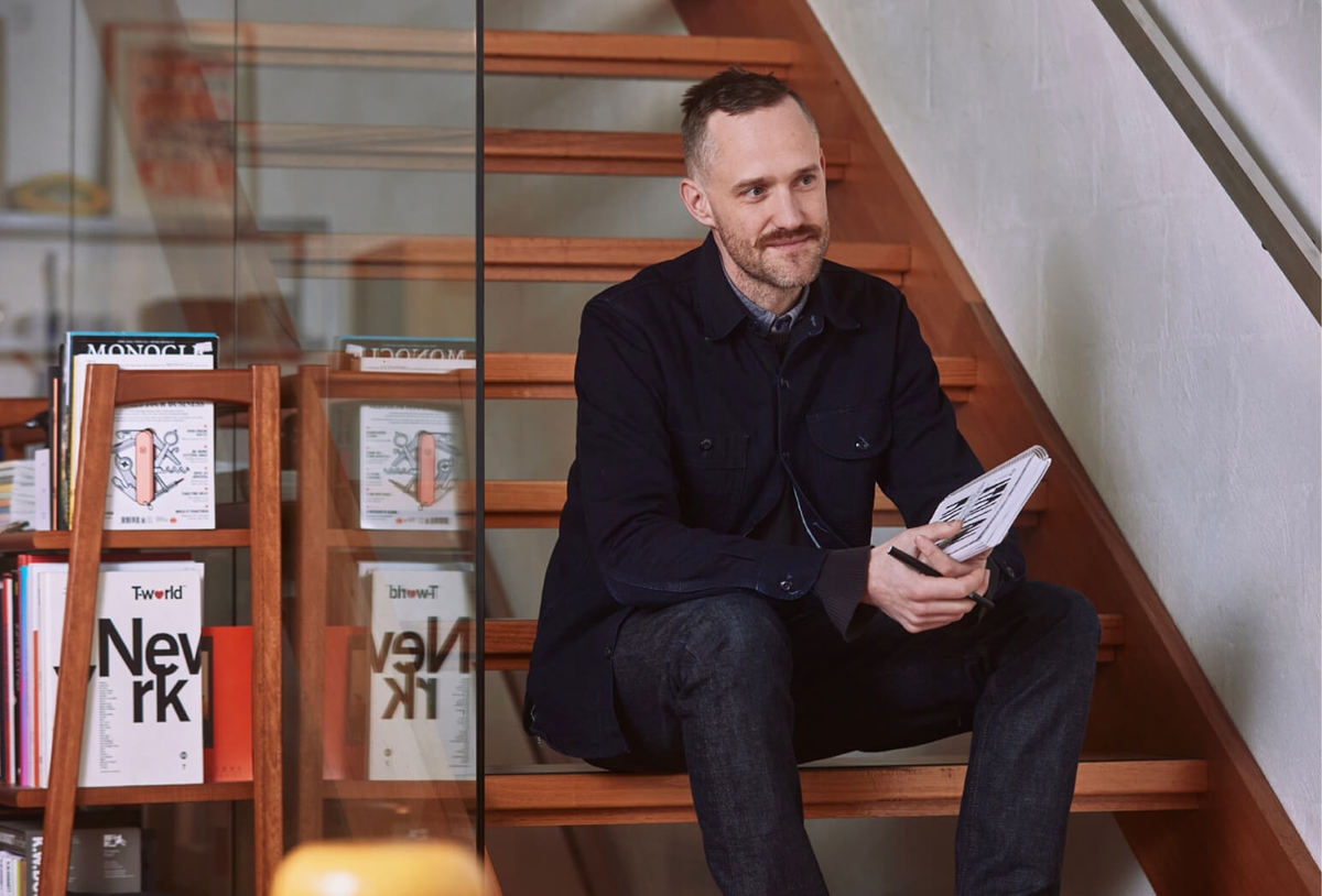 Nick Thorn - Head of Digital Director - Sitting on staircase at Atollon Collingwood Studio