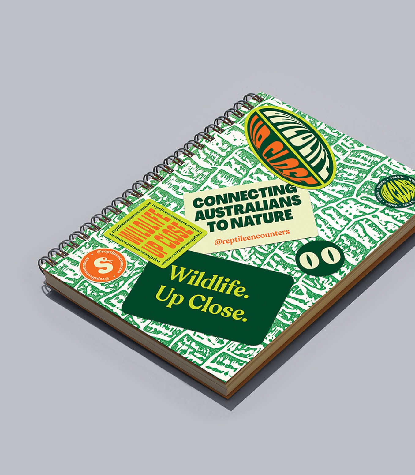Reptile Encounters note book cover design covered in stickers